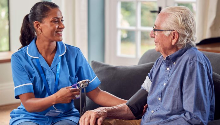 senior-man-at-home-in-lounge-having-blood-pressure-2024-10-21-16-42-10-5CPAUWQ.jpg